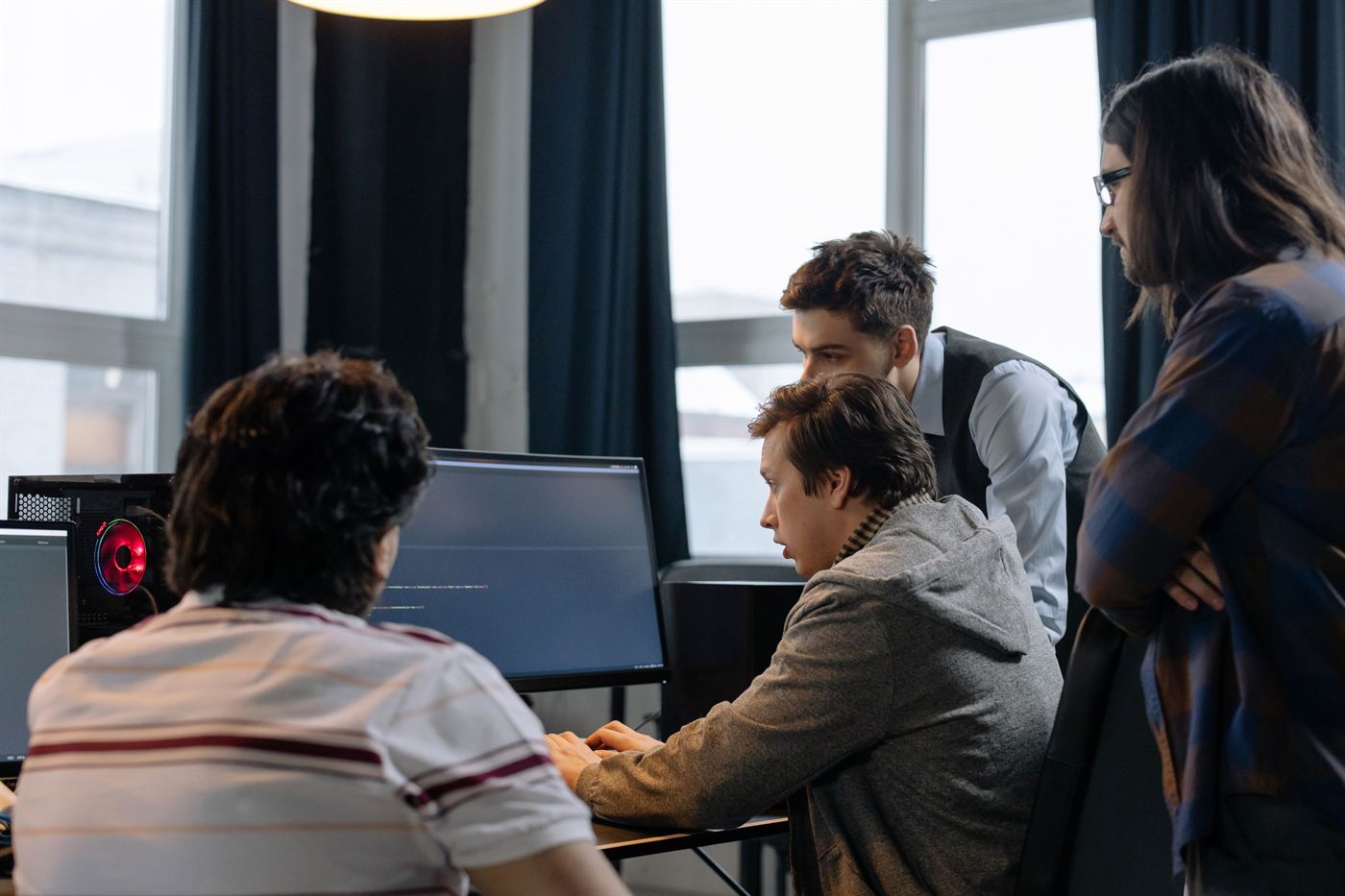 Adults looking at a computer screen together